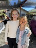 girls showing off face painting