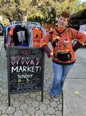 picture of Joey next to the pop up market sign